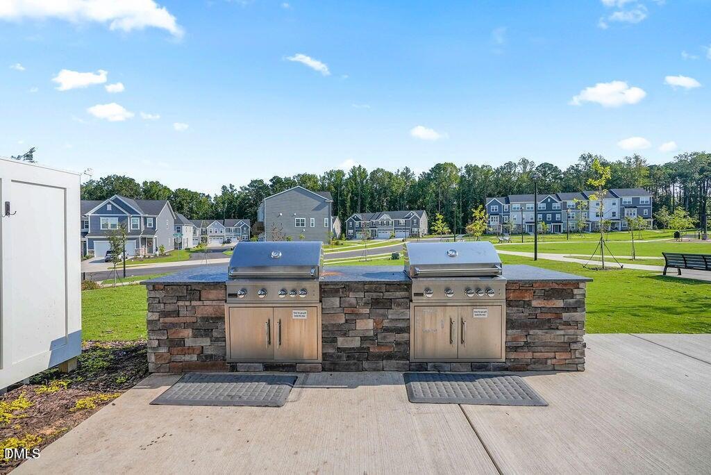 1811 Aspen River Lane Apex, NC 27502 - Photo 47 of 53 a patio with a yard and entertaining space