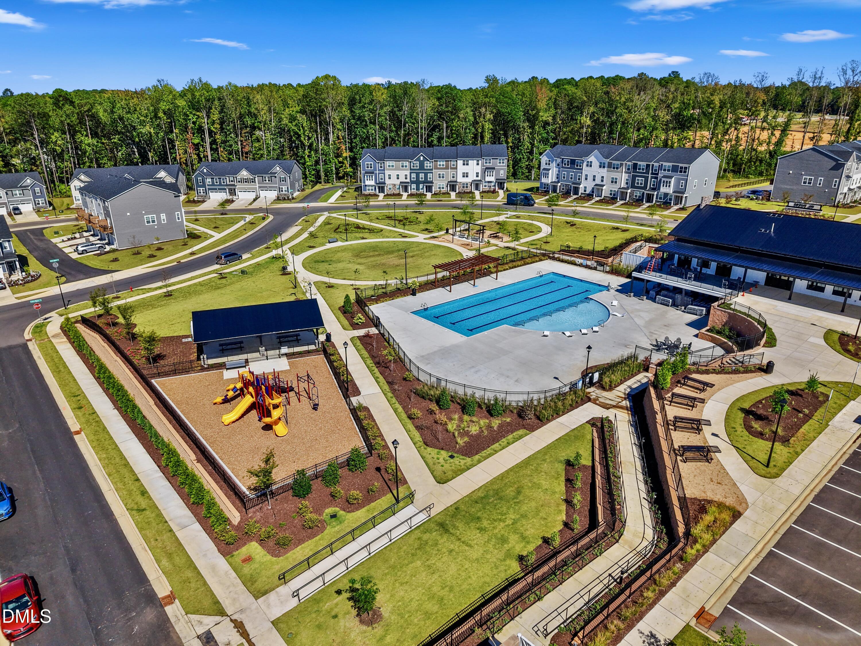 1811 Aspen River Lane Apex, NC 27502 - Photo 5 of 53 a view of a swimming pool with a patio and a mountain view