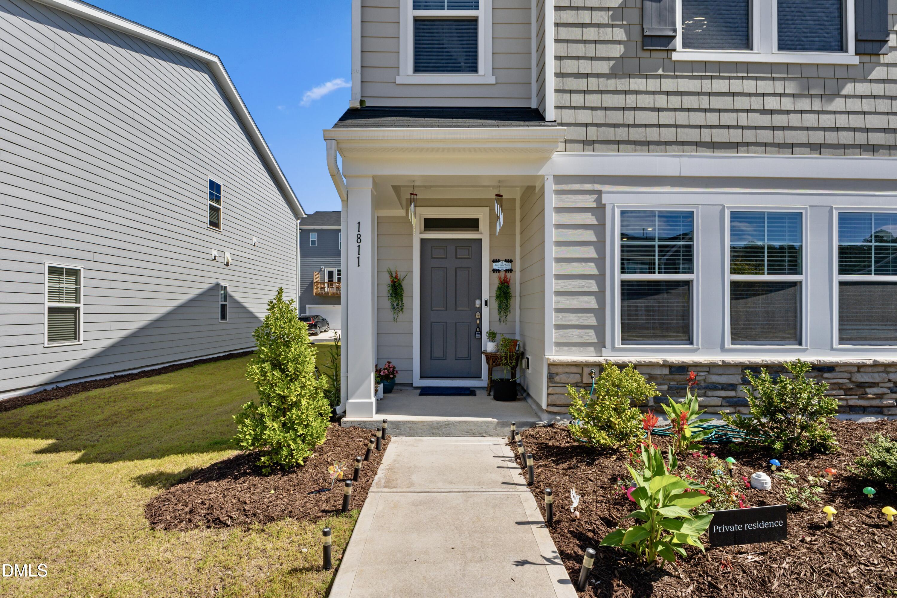 1811 Aspen River Lane Apex, NC 27502 - Photo 10 of 53 a view of a entryway door front of house