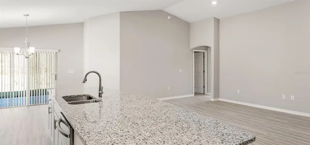 a view of a kitchen counter space and a sink