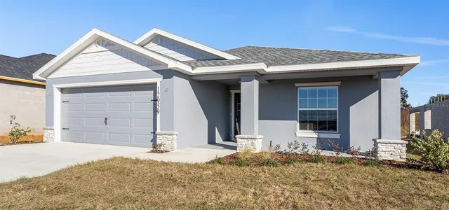 a view of a house with potted plants