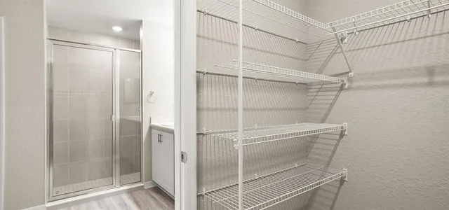 a bathroom with a walk in closet
