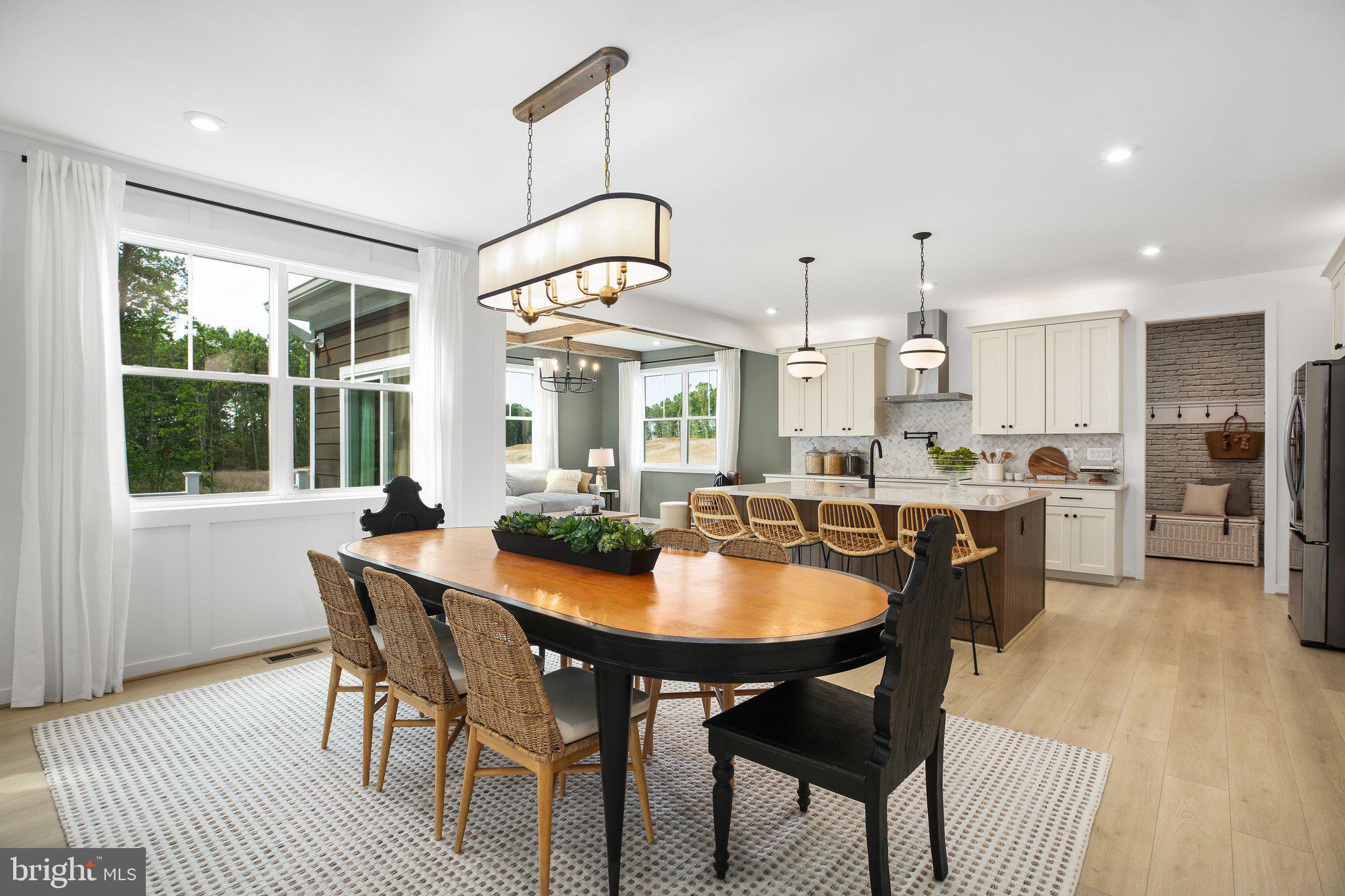 2 Spotswood Furnace Road Fredericksburg, VA 22407 - Photo 11 of 43 a dining room with stainless steel appliances kitchen island a table and chairs