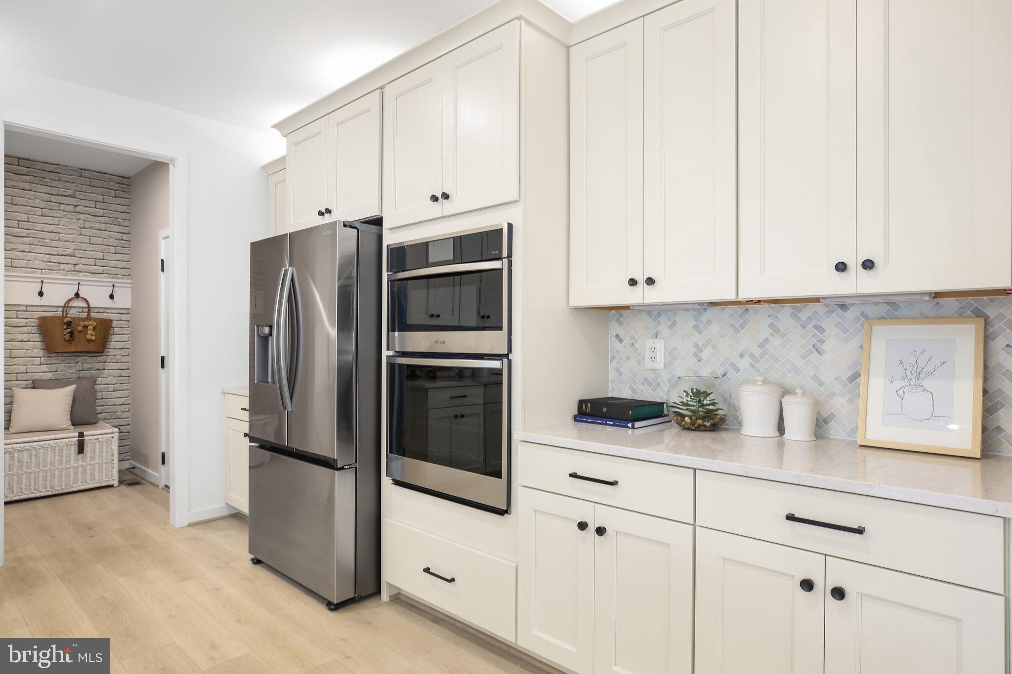 2 Spotswood Furnace Road Fredericksburg, VA 22407 - Photo 13 of 43 a kitchen with stainless steel appliances white cabinets and a refrigerator