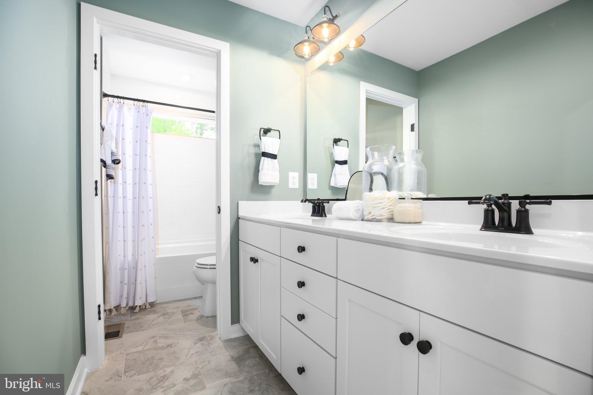 2 Spotswood Furnace Road Fredericksburg, VA 22407 - Photo 30 of 43 a bathroom with a double vanity sink a mirror and a shower