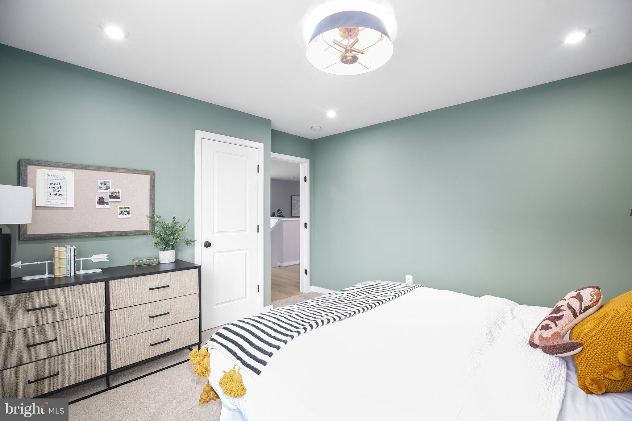 2 Spotswood Furnace Road Fredericksburg, VA 22407 - Photo 32 of 43 a bedroom with a bed and a chandelier