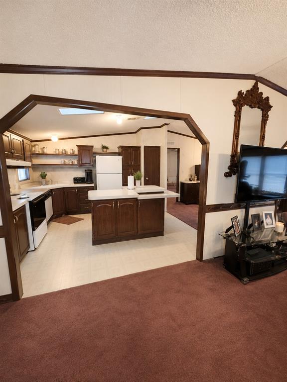 2665 Absher Road St. Cloud, FL 34771 - Photo 16 of 27 a living room with furniture and a flat screen tv