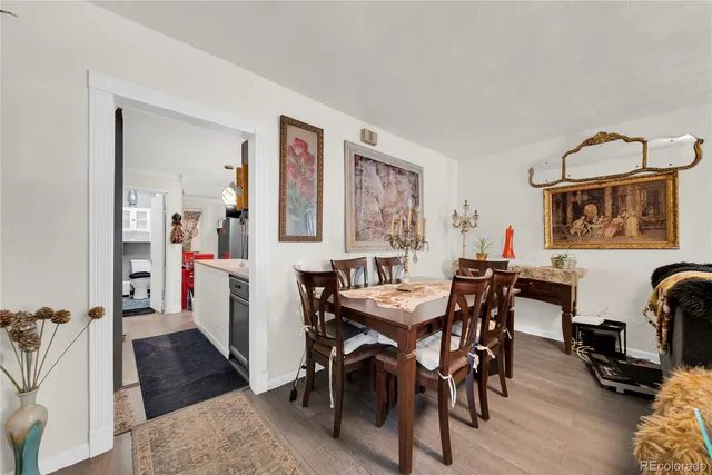 a view of a dining room with furniture and a rug