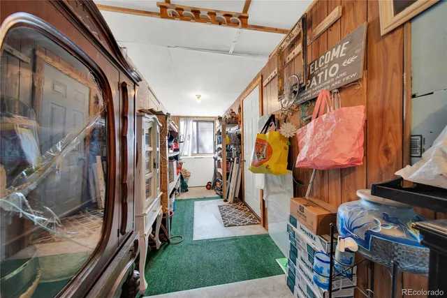 wooden floor with a gaming machine and chairs