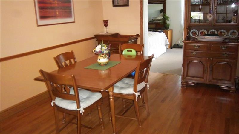 1152 Harmony Road Baden, PA 15005 - Photo 14 of 25 Dining Room featuring beautiful hardwood flooring and oak trim
