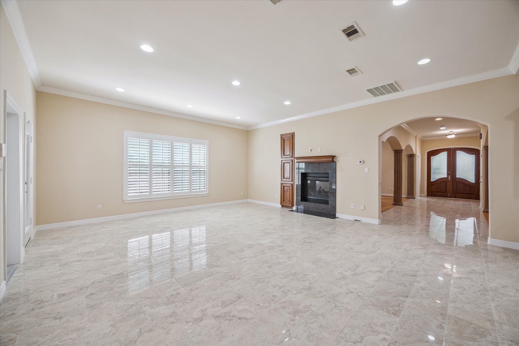 2601 Talbott Street Houston, TX 77005 - Photo 12 of 25 an empty room with fireplace and a window
