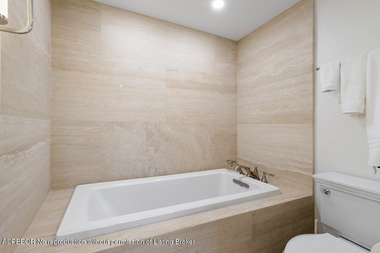 130 Sunrise Avenue, Unit 616 Palm Beach, FL 33480 - Photo 16 of 34 a bath tub sitting next to a white toilet