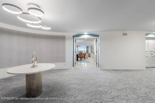 a view of a hallway with entryway dining table and chairs