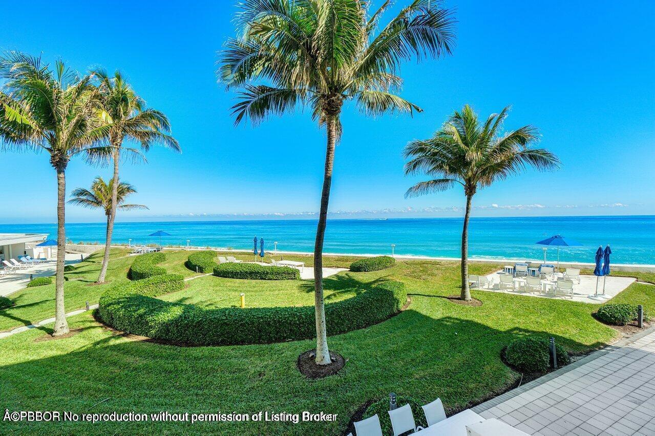 130 Sunrise Avenue, Unit 616 Palm Beach, FL 33480 - Photo 29 of 34 a view of a swimming pool with a garden