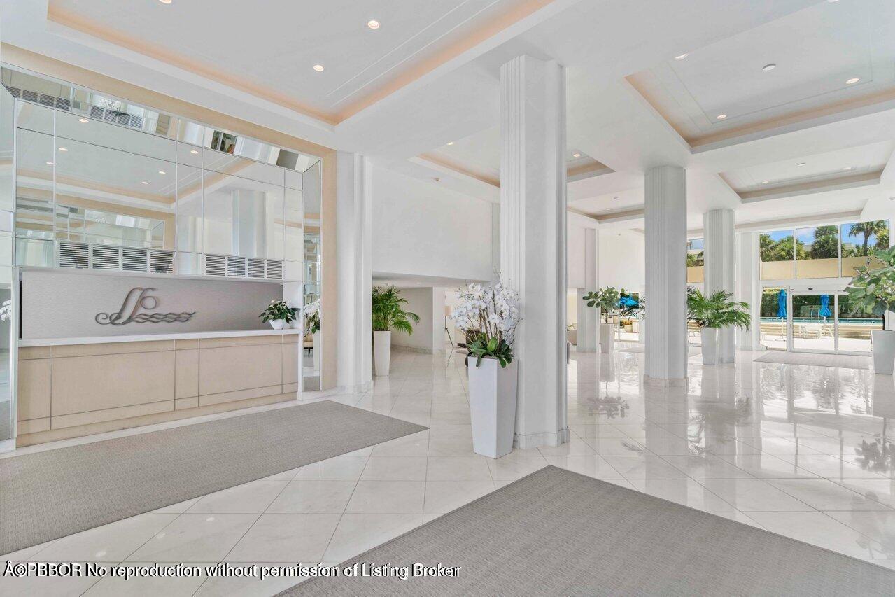 130 Sunrise Avenue, Unit 616 Palm Beach, FL 33480 - Photo 33 of 34 a bathroom with a tub shower and mirror