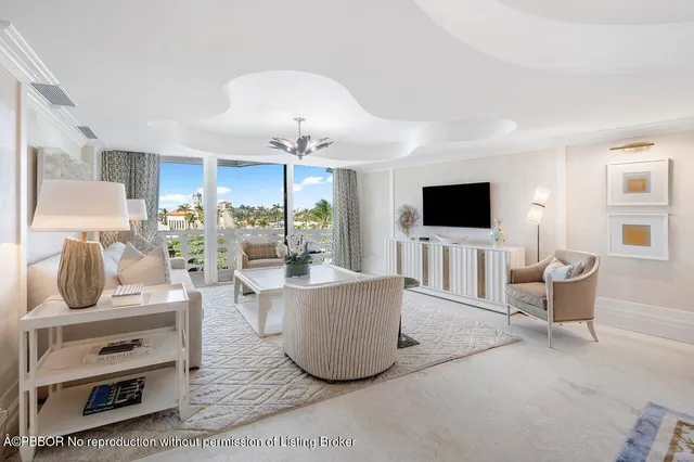 a living room with furniture and flat screen tv