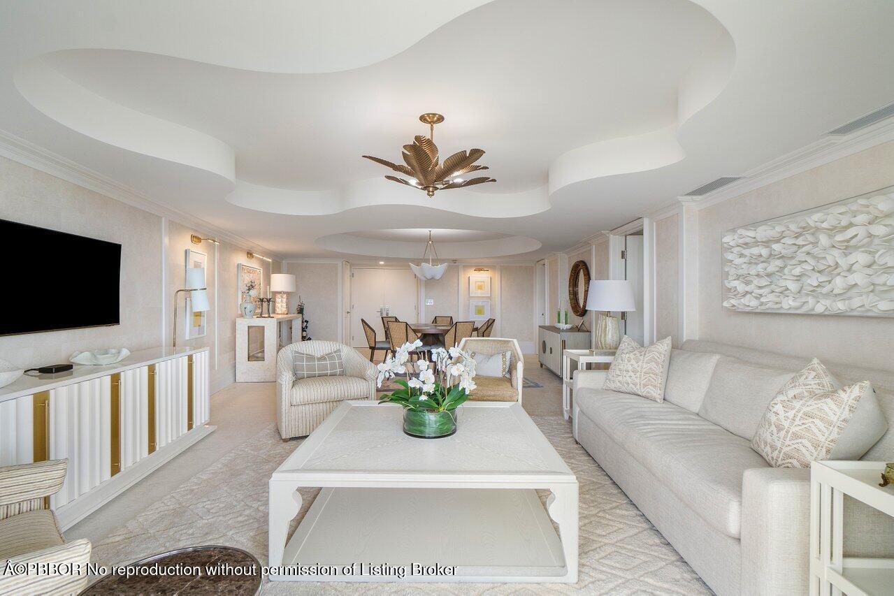 130 Sunrise Avenue, Unit 616 Palm Beach, FL 33480 - Photo 5 of 34 a living room with furniture and a flat screen tv