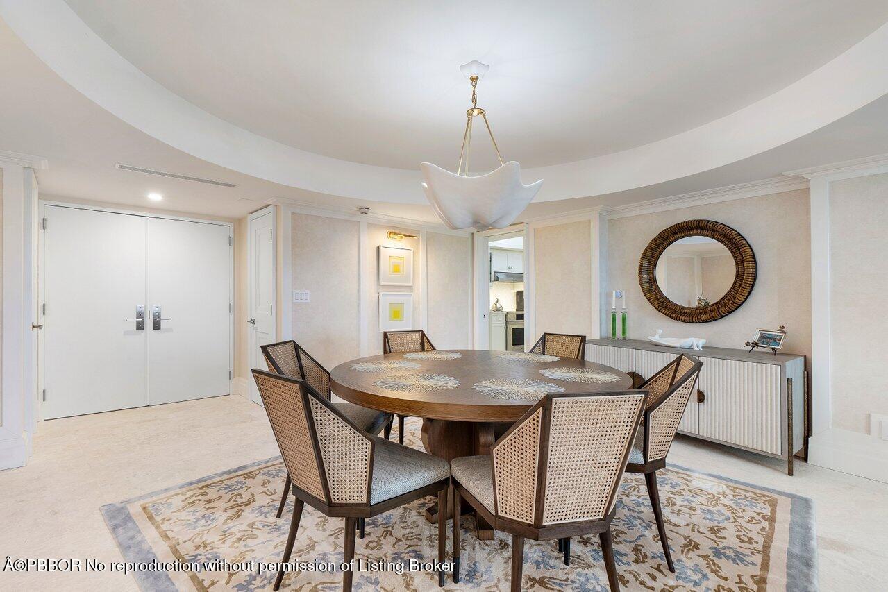 130 Sunrise Avenue, Unit 616 Palm Beach, FL 33480 - Photo 8 of 34 a dining room with furniture and a mirror