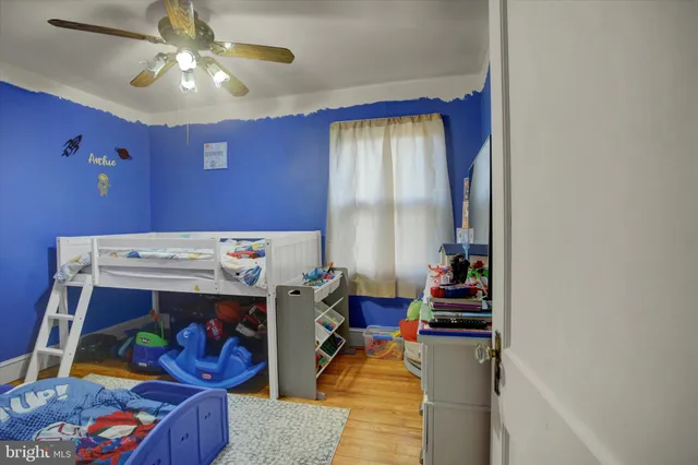 a bed room with a bed and a chandelier