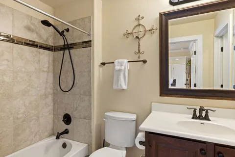 a bedroom with a bed closet and a window