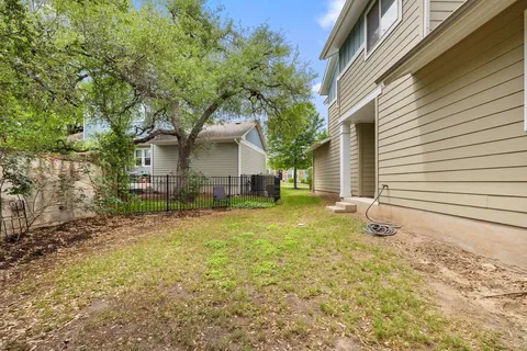 a backyard of a house with lots of green space