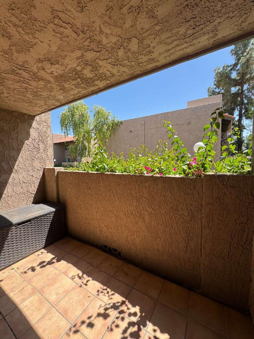 5525 East Thomas Road, Unit F1 Phoenix, AZ 85018 - Photo 12 of 14 a view of balcony with wooden floor