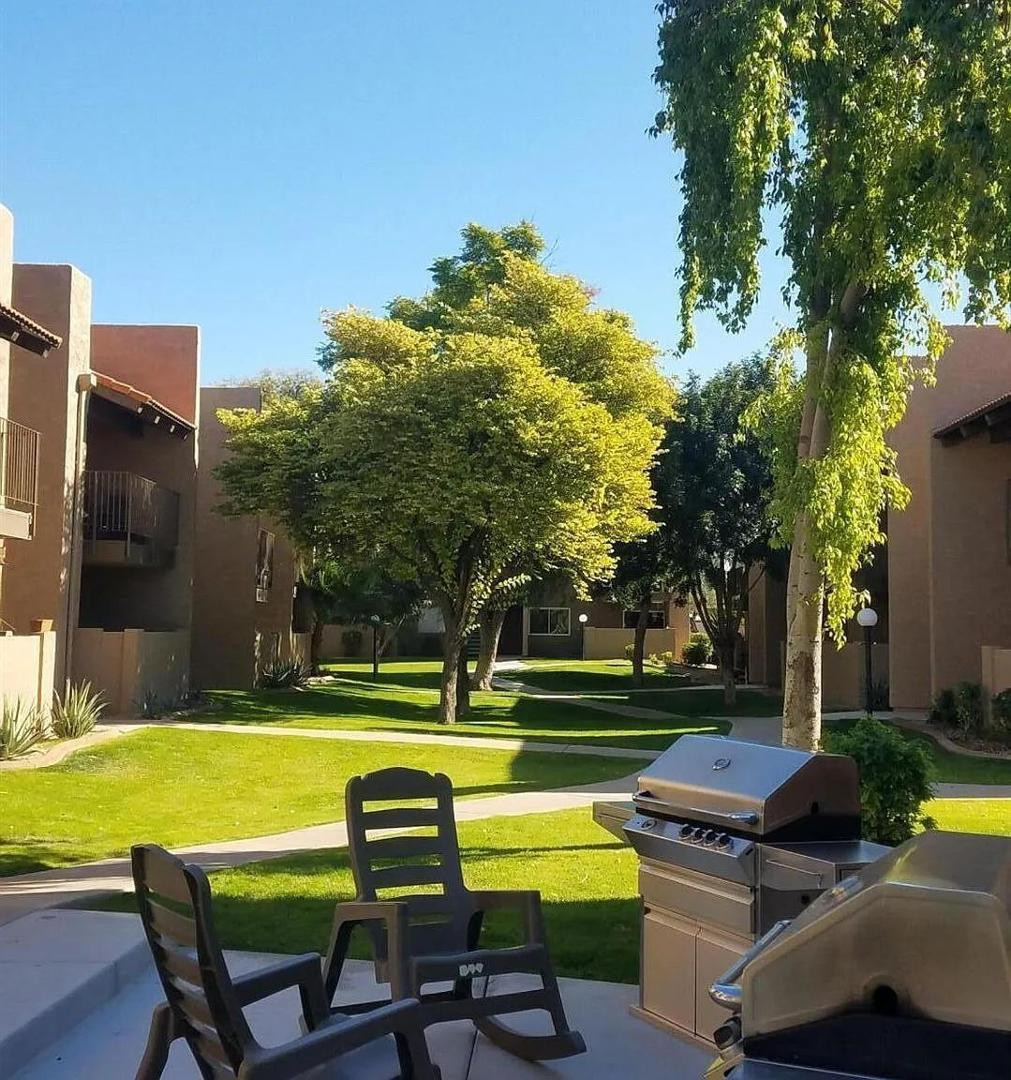 5525 East Thomas Road, Unit F1 Phoenix, AZ 85018 - Photo 13 of 14 a view of a swimming pool with a lounge chairs