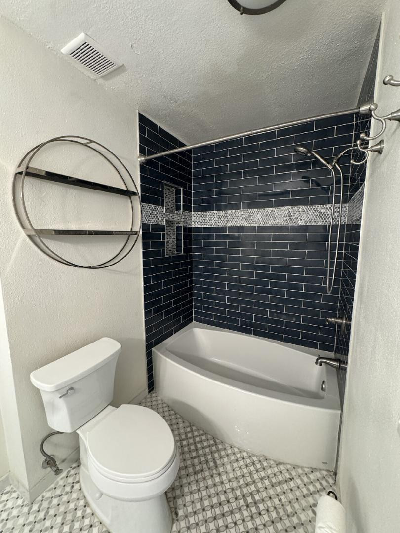 5525 East Thomas Road, Unit F1 Phoenix, AZ 85018 - Photo 8 of 14 a bathroom with a toilet and a shower