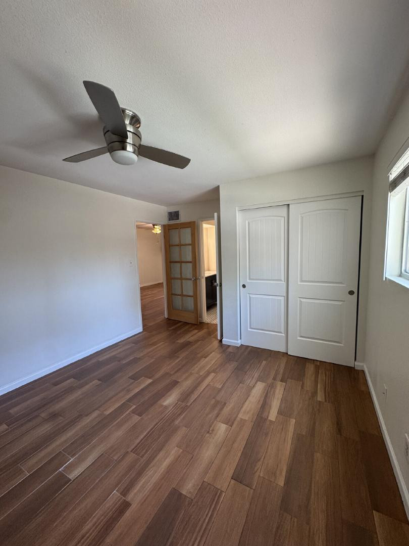 5525 East Thomas Road, Unit F1 Phoenix, AZ 85018 - Photo 10 of 14 a view of an empty room and wooden floor