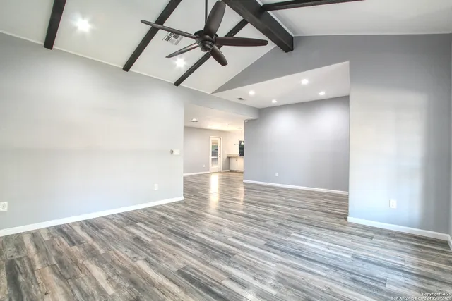 a kitchen with a sink stove oven and white