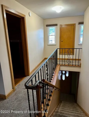 a view of a balcony with wooden floor
