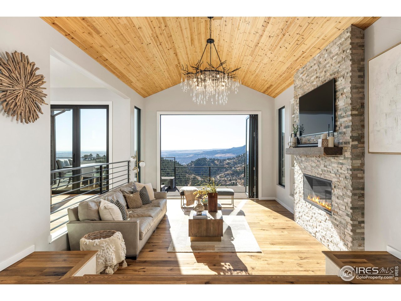 In 2025, this home was taken through a comprehensive remodel. Soaring tongue-and-groove wood ceilings, 7" hardwood floors, custom tile, all-new Pella windows, automated blinds, and skylights flood the home with light.