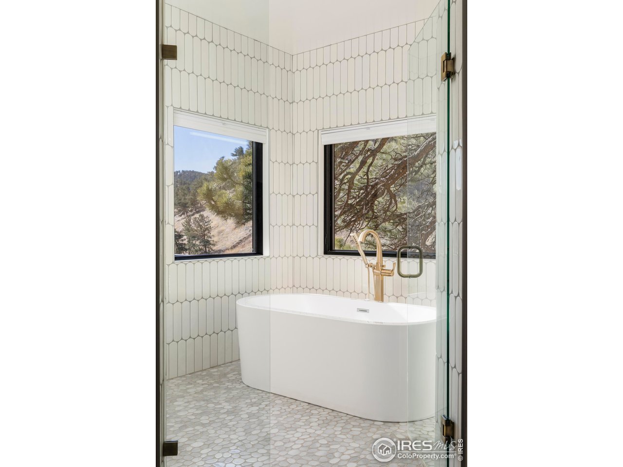 150 Valley View Way Boulder, CO 80304 - Photo 11 of 36 The spa-inspired bathroom includes a custom wet room with soaking tub, multi-head shower, refined tilework, and a generous walk-in closet.