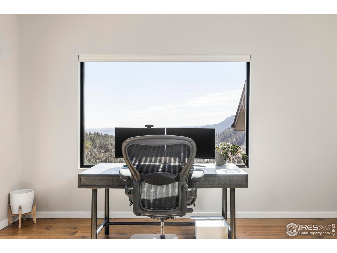 150 Valley View Way Boulder, CO 80304 - Photo 21 of 36 Above it all, the office claims some of the home's most dramatic mountain views, creating an inspiring work-from-home environment.