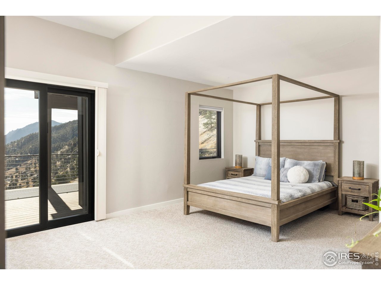 150 Valley View Way Boulder, CO 80304 - Photo 24 of 36 Two additional bedrooms anchor the lower level, one en-suite and both opening to the deck, creating bright and comfortable accommodations.