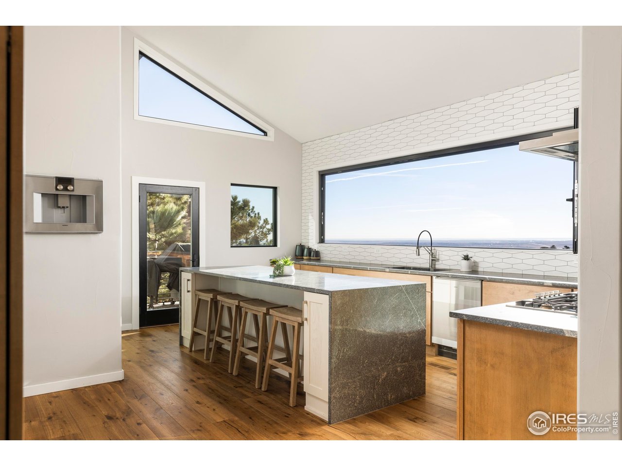 150 Valley View Way Boulder, CO 80304 - Photo 5 of 36 The kitchen centers on a dramatic waterfall island complemented by a full suite of Gaggenau appliances.
