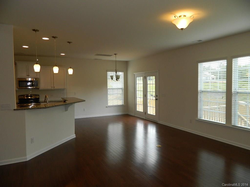 505 Brookhaven Drive, Unit HC82 Fort Mill, SC 29708 - Photo 9 of 9 a view of an empty room with wooden floor and a window