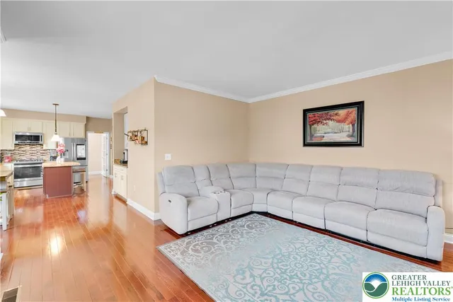 a view of walk in closet with clothes