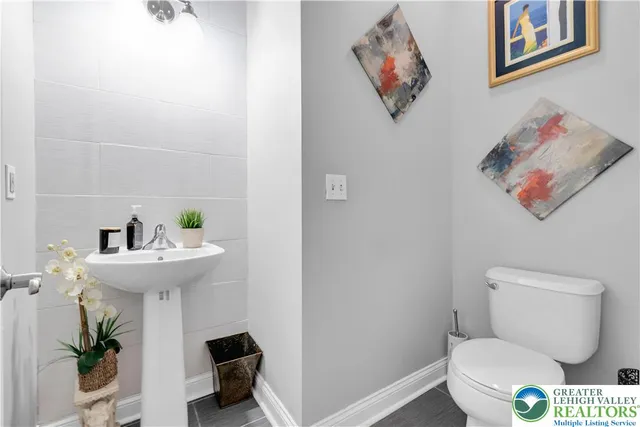 a bed room with a bed and a flat screen tv