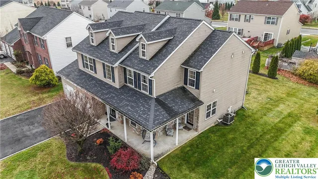 aerial view of a house with table and chairs