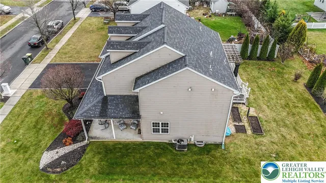 a front view of house with yard and green space