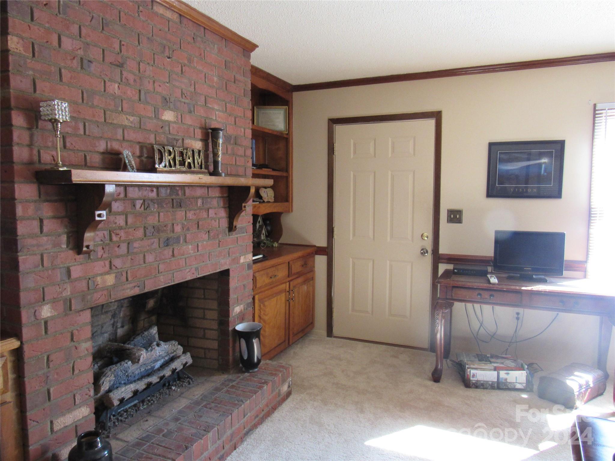171 Fox Run Road Forest City, NC 28043 - Photo 13 of 32 a living room with furniture and a fireplace