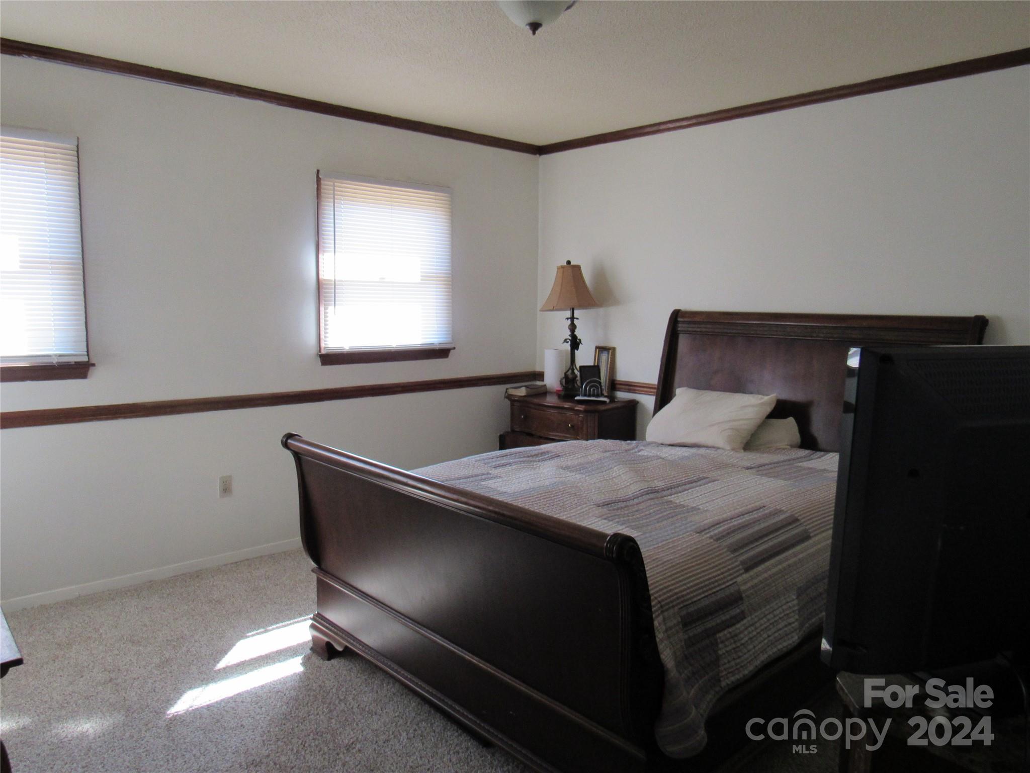 171 Fox Run Road Forest City, NC 28043 - Photo 18 of 32 a bed sitting in a bedroom next to a window