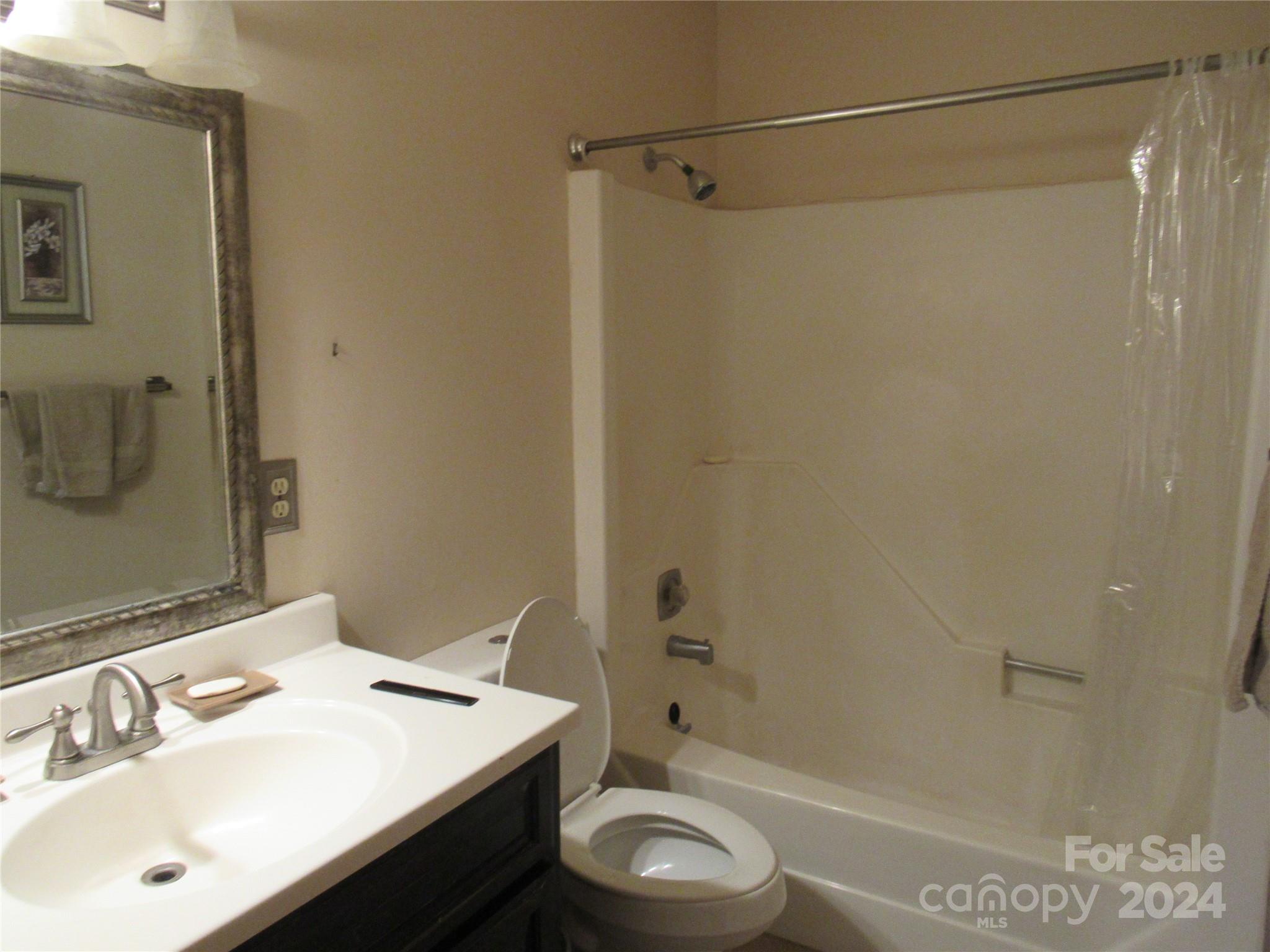 171 Fox Run Road Forest City, NC 28043 - Photo 20 of 32 a bathroom with a sink a toilet and shower