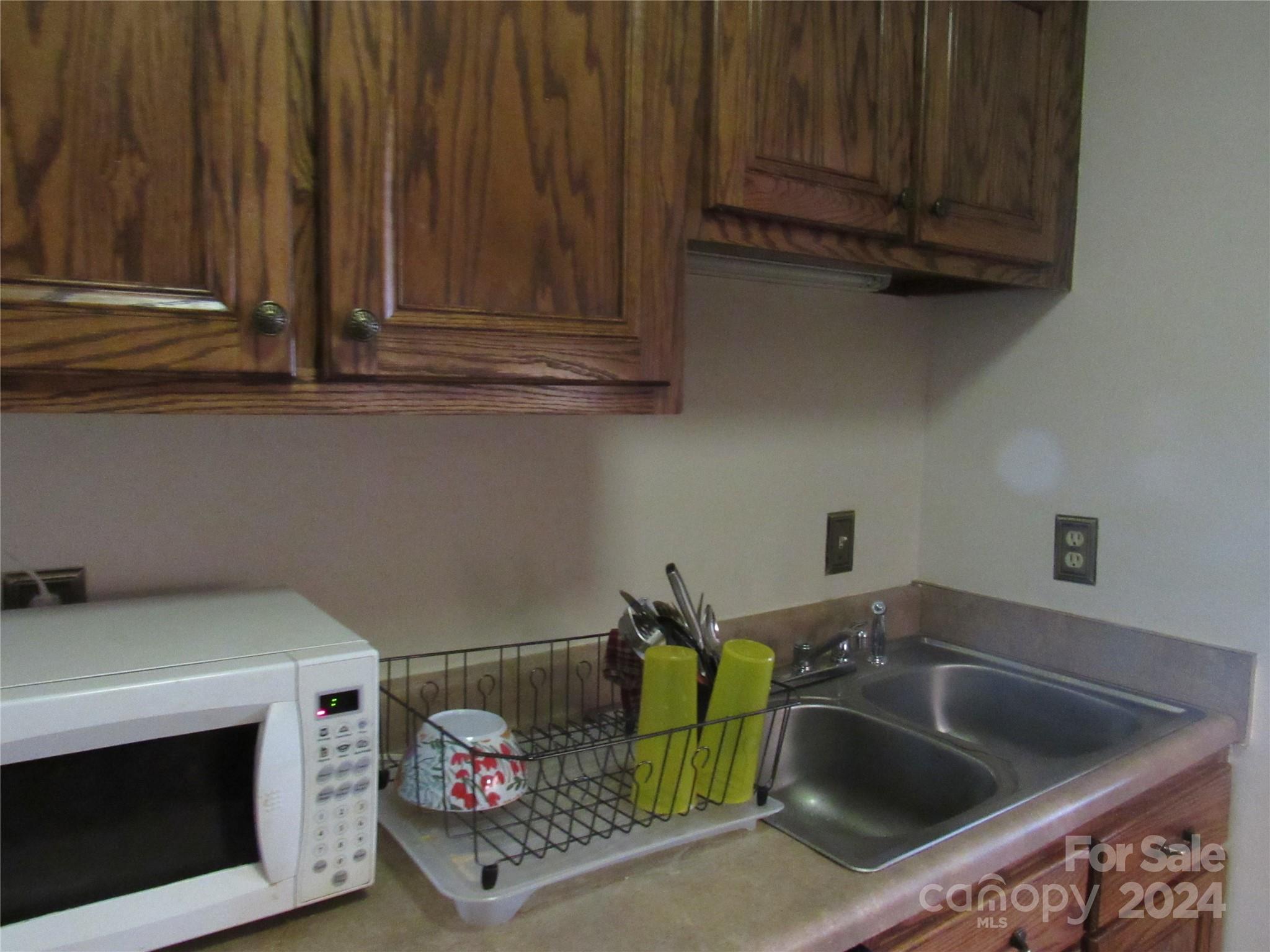 171 Fox Run Road Forest City, NC 28043 - Photo 8 of 32 a kitchen with a sink and cabinets