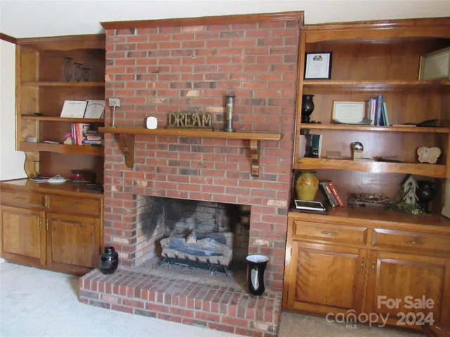 a living room with a fireplace