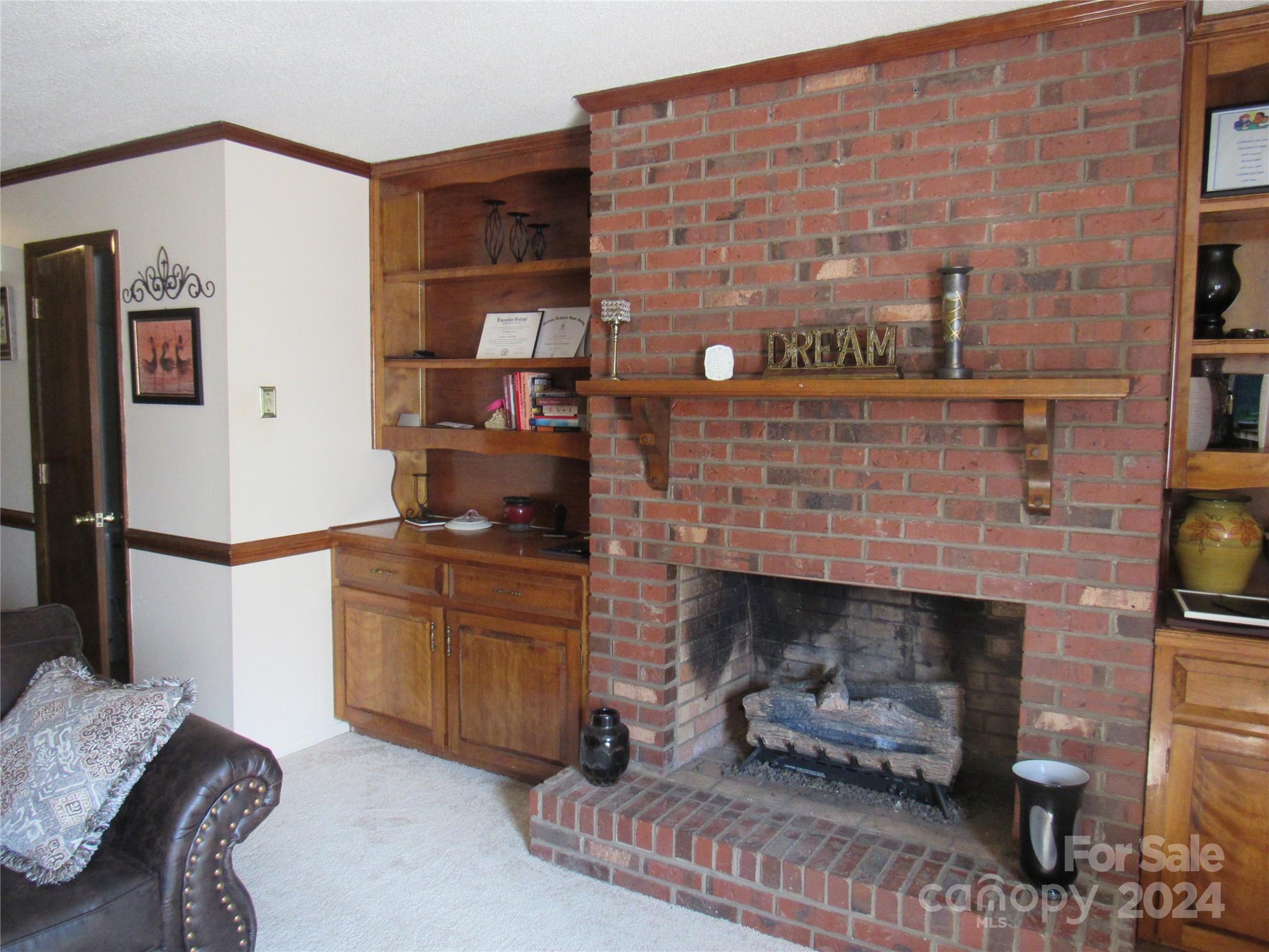 171 Fox Run Road Forest City, NC 28043 - Photo 10 of 32 a living room with furniture and a fireplace