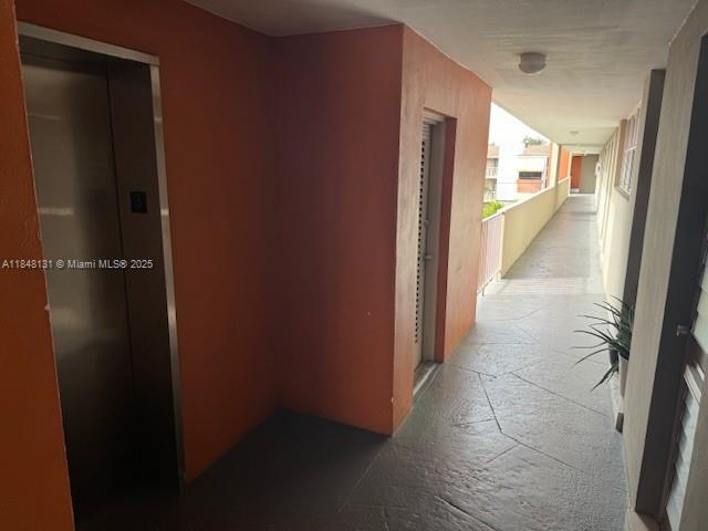 1850 Northeast 169th Street, Unit 308 North Miami Beach, FL 33162 - Photo 14 of 29 a view of a hallway
