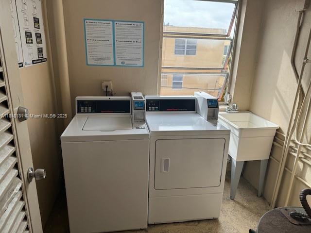 1850 Northeast 169th Street, Unit 308 North Miami Beach, FL 33162 - Photo 15 of 29 a utility room with dryer and washer