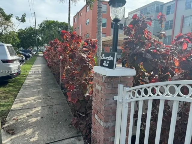 a garden with trees in front of it